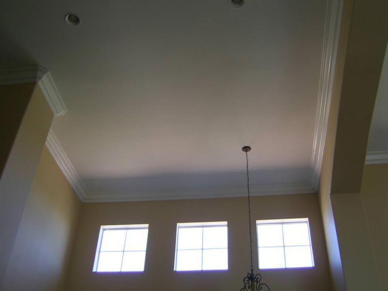 Refinished and painted cathedral ceiling in living room