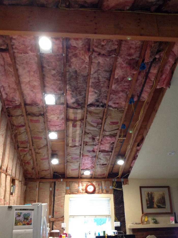 Drywall down in the ceiling and walls of kitchen